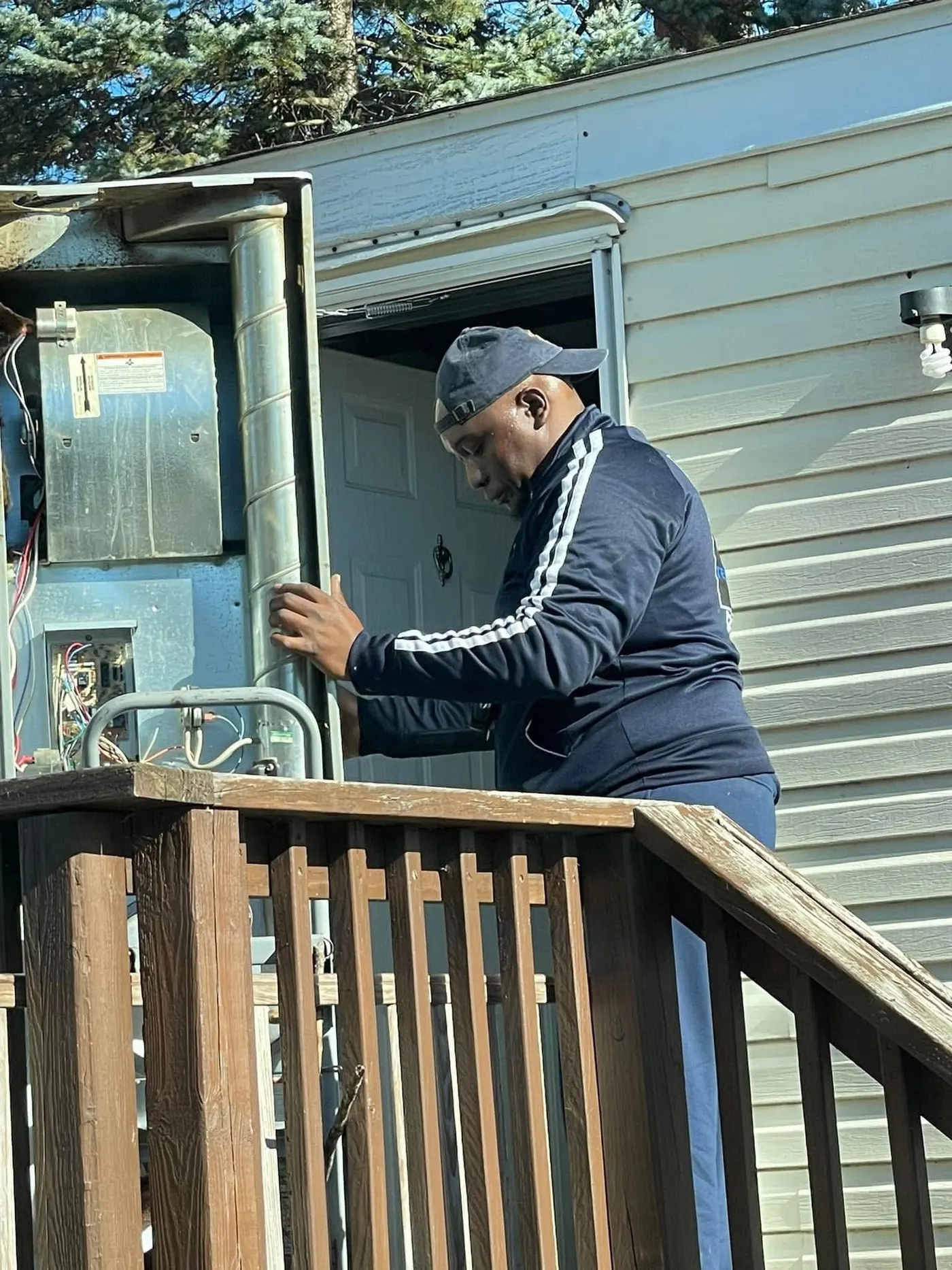 Al from Temprasure reaching into an open package unit on a manufactured home